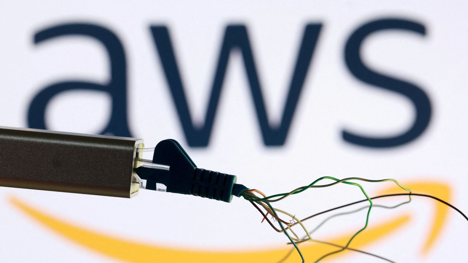 AWS logo and broken ethernet cable are seen in this illustration taken October 20, 2025. REUTERS/Dado Ruvic/Illustration