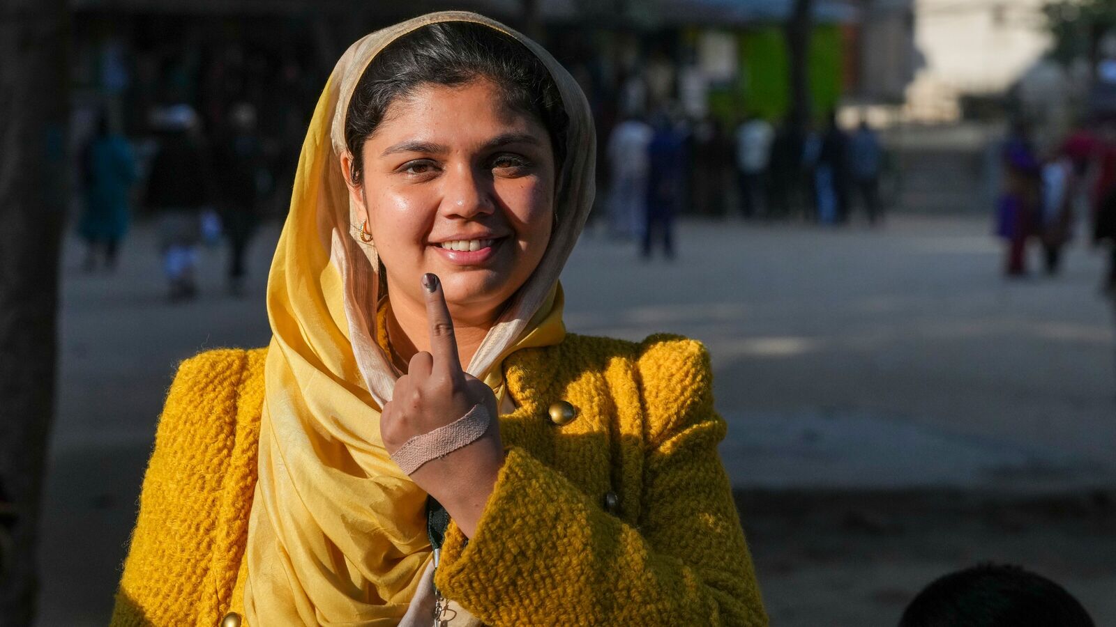 New Delhi: A voter shows her inked finger after casting a vote for the Delhi Assembly election, in New Delhi, Wednesday, Feb. 5, 2025. 